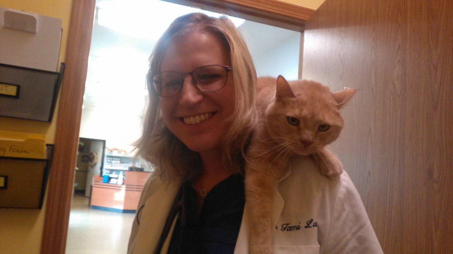 Doctor with a Cat on her Shoulders